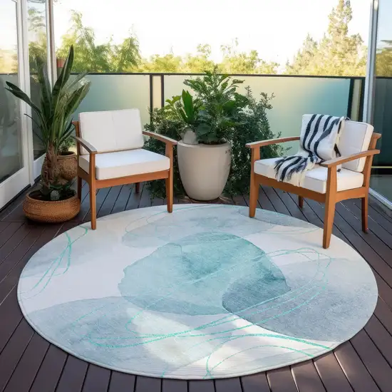 Teal and Ivory Round Abstract Washable Non Skid Indoor Outdoor Area Rug Photo 7