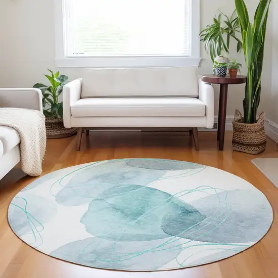 Teal and Ivory Round Abstract Washable Non Skid Indoor Outdoor Area Rug Photo 8