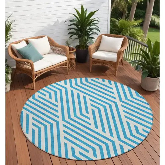 8' Round Teal and White Round Geometric Washable Non Skid Indoor Outdoor Area Rug Photo 1