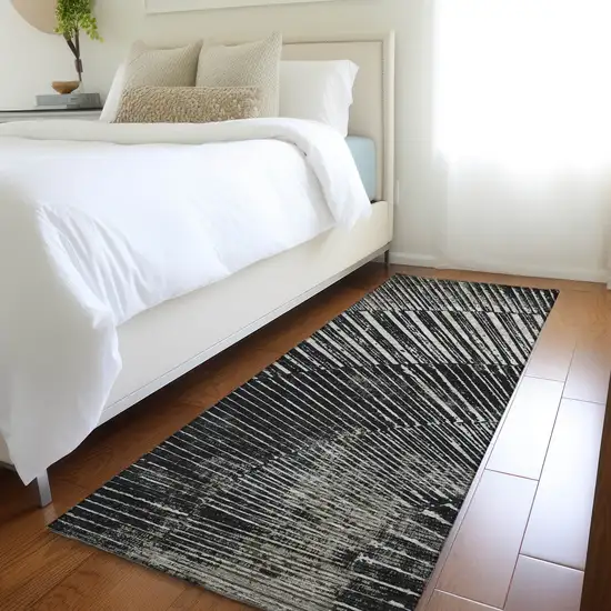 8' Runner Black and Ivory Abstract Washable Non Skid Indoor Outdoor Runner Rug Photo 9