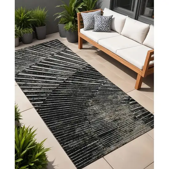 8' Runner Black and Ivory Abstract Washable Non Skid Indoor Outdoor Runner Rug Photo 1