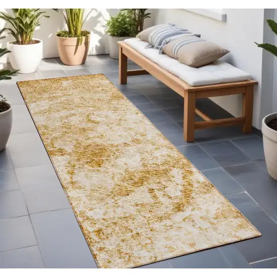 8' Runner Cream and Gold Abstract Washable Non Skid Indoor Outdoor Runner Rug Photo 1