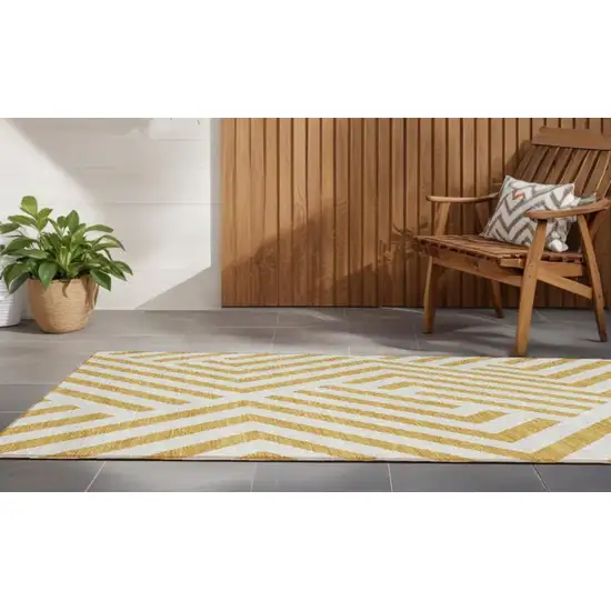 Gold and White Geometric Washable Non Skid Indoor Outdoor Runner Rug Photo 1