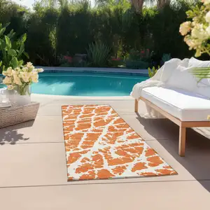 Photo of 8' Runner Orange and White Abstract Washable Non Skid Indoor Outdoor Runner Rug