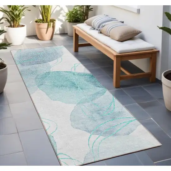 Teal and Ivory Abstract Washable Non Skid Indoor Outdoor Runner Rug Photo 1