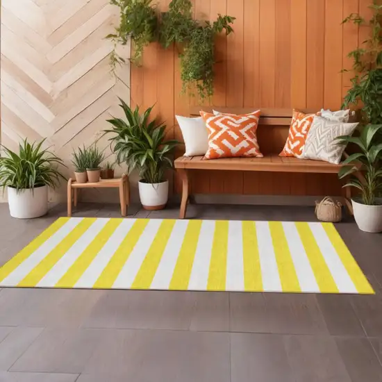 Yellow and White Striped Washable Indoor Outdoor Runner Rug Photo 1