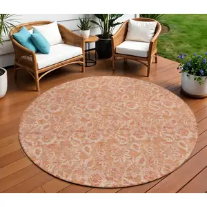 Photo of 8' Salmon And Copper Round Floral Washable Indoor Outdoor Area Rug