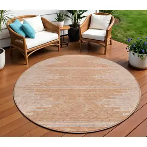 Photo of 8' Salmon And Ivory Round Abstract Washable Indoor Outdoor Area Rug