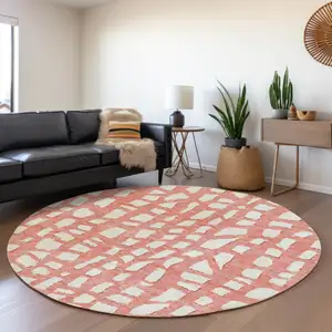 Photo of 8' Salmon And Ivory Round Abstract Washable Indoor Outdoor Area Rug