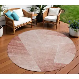 Photo of 8' Salmon And Ivory Round Abstract Washable Indoor Outdoor Area Rug