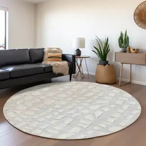 Photo of 8' Silver And Ivory Round Abstract Washable Indoor Outdoor Area Rug