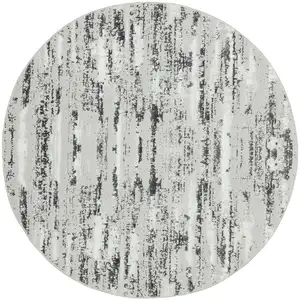 Photo of 4' Silver Round Abstract Washable Non Skid Area Rug With Fringe