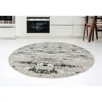 Photo of 7' Silver Round Abstract Washable Non Skid Area Rug With Fringe
