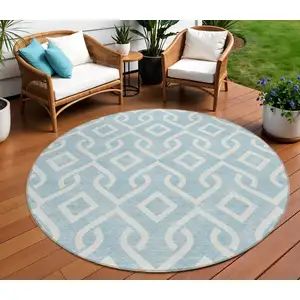 Photo of 8' Sky Blue And Ivory Round Geometric Washable Indoor Outdoor Area Rug