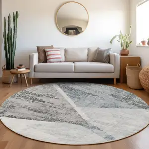 Photo of 8' Sky Blue Gray And Charcoal Round Abstract Washable Indoor Outdoor Area Rug