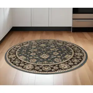 Photo of 6' Slate Blue Black and Ivory Floral Round Rug