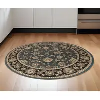 Photo of 6' Slate Blue Black and Ivory Floral Round Rug