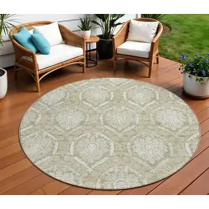 Photo of 8' Tan And Beige Round Medallion Washable Indoor Outdoor Area Rug