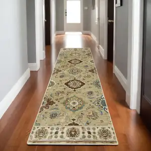 Photo of 8' Tan Blue And Brown Floral Runner Rug With Fringe