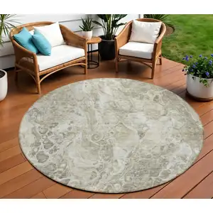 Photo of 8' Tan Brown And Beige Round Abstract Washable Indoor Outdoor Area Rug