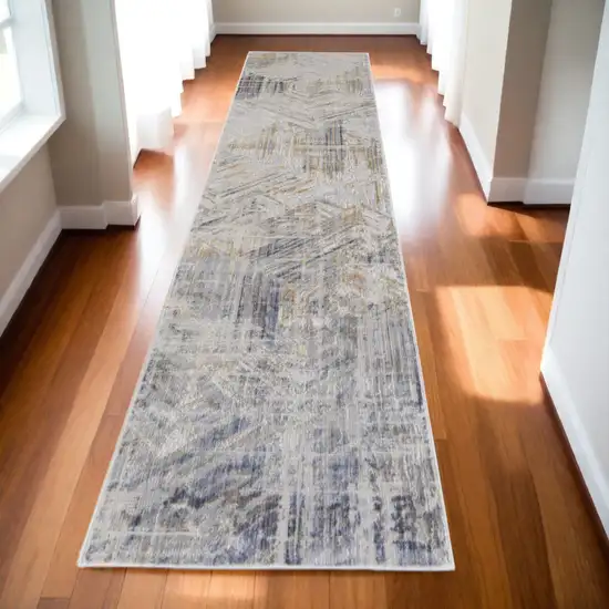 10' Tan and Ivory Abstract Power Loom Distressed Non Skid Runner Rug Photo 1