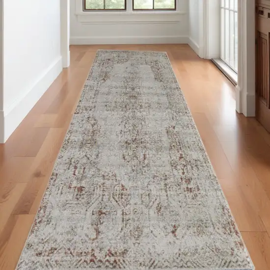 10' Tan and Ivory Floral Power Loom Distressed Non Skid Runner Rug Photo 1