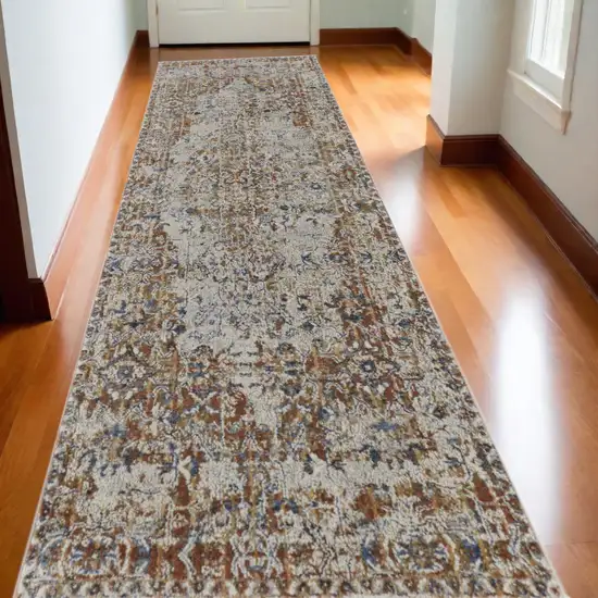 10' Tan and Ivory Floral Power Loom Non Skid Runner Rug Photo 1