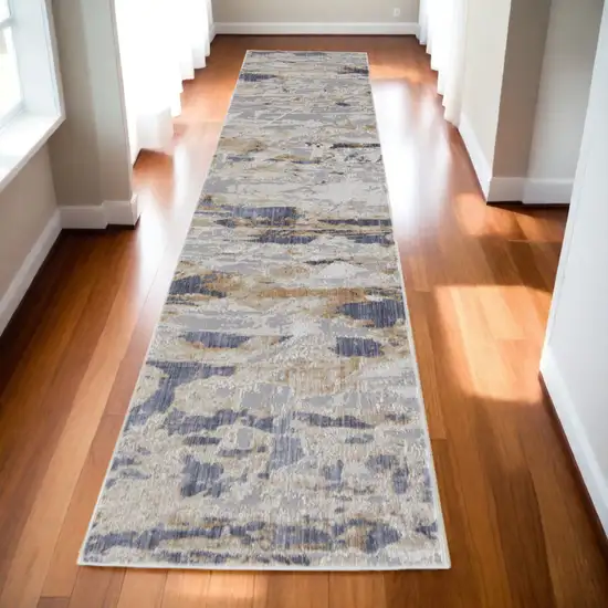 10' Tan and Ivory Abstract Power Loom Distressed Non Skid Runner Rug Photo 1