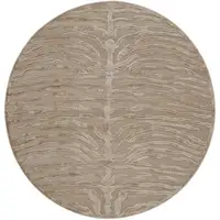 Photo of 8' Tan and Ivory Animal Print Power Loom Round Rug