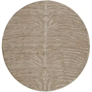 Photo of 8' Tan and Ivory Animal Print Power Loom Round Rug