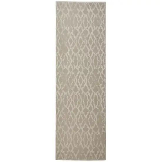 8' Tan and Ivory Geometric Power Loom Worn Faded Runner Rug Photo 1