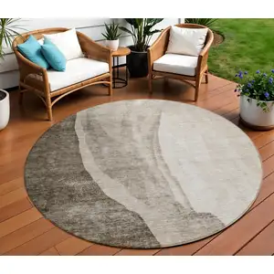 Photo of 8' Taupe And Brown Round Abstract Washable Indoor Outdoor Area Rug