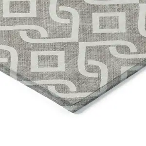 Photo of 8' Taupe And Ivory Round Geometric Washable Indoor Outdoor Area Rug