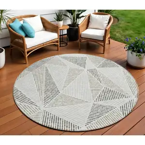 Photo of 8' Taupe Brown And Beige Round Geometric Washable Indoor Outdoor Area Rug