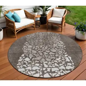 Photo of 8' Taupe Brown And Ivory Round Abstract Washable Indoor Outdoor Area Rug