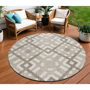 Photo of 8' Taupe Brown And Ivory Round Geometric Washable Indoor Outdoor Area Rug