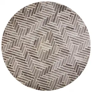 Photo of 8' Taupe Gray And Tan Round Wool Geometric Tufted Handmade Area Rug