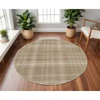 Photo of 8' Taupe and Ivory Plaid Round Rug