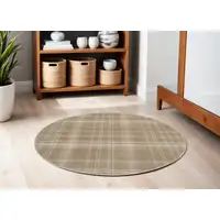 Photo of 4' Taupe and Ivory Plaid Round Rug