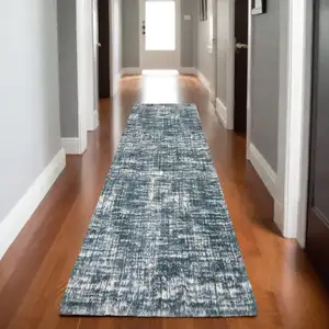 Photo of 8' Teal And Ivory Geometric Runner Rug