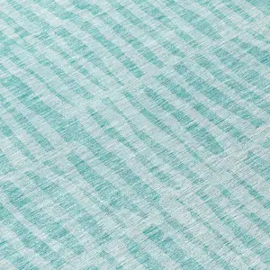 Photo of 8' Teal Blue And Aqua Round Striped Washable Indoor Outdoor Area Rug