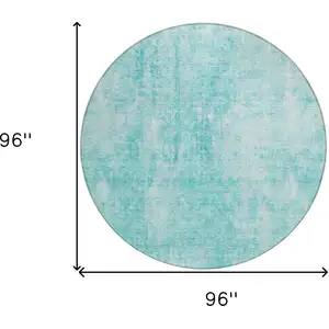 Photo of 8' Teal Blue And Ivory Round Abstract Washable Indoor Outdoor Area Rug