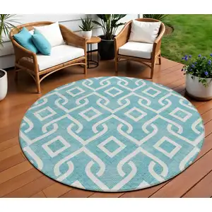 Photo of 8' Teal Blue And Ivory Round Geometric Washable Indoor Outdoor Area Rug