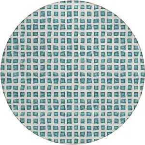 Photo of 8' Teal Blue And Ivory Round Geometric Washable Indoor Outdoor Area Rug