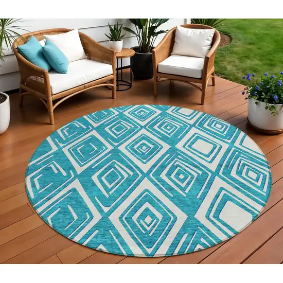 8' Teal Blue And Ivory Round Geometric Washable Indoor Outdoor Area Rug Photo 1