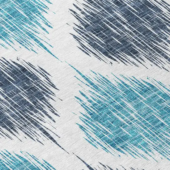 8' Teal Blue And Ivory Round Ikat Washable Indoor Outdoor Area Rug Photo 7