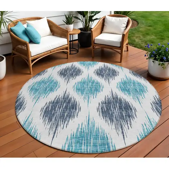 8' Teal Blue And Ivory Round Ikat Washable Indoor Outdoor Area Rug Photo 8