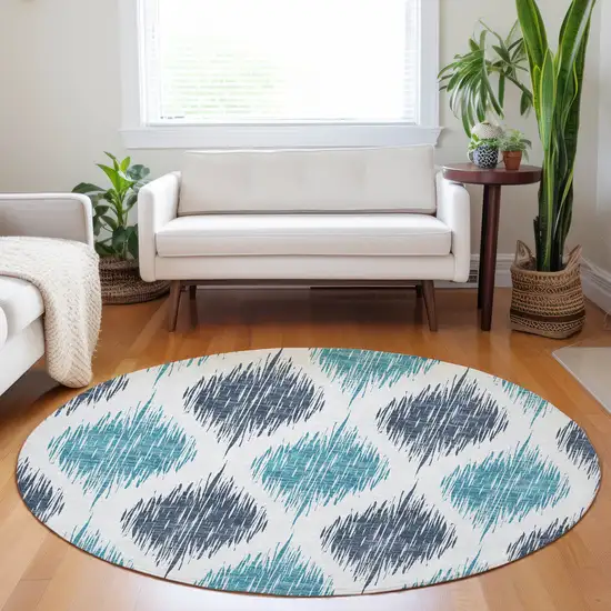 8' Teal Blue And Ivory Round Ikat Washable Indoor Outdoor Area Rug Photo 5