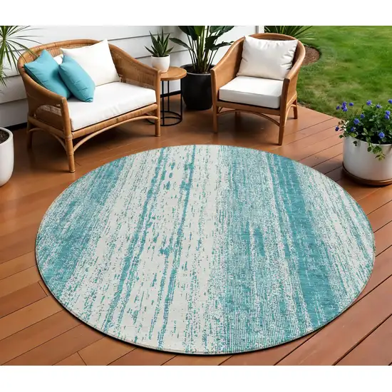 8' Teal Blue And Ivory Round Striped Washable Indoor Outdoor Area Rug Photo 1