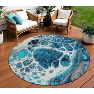 Photo of 8' Teal Blue And Navy Blue Round Nautical Washable Indoor Outdoor Area Rug